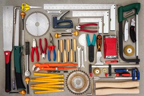 Flat lay of old hand tools on concrete background. Stock Photos