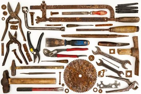 Flat lay of old hand tools on white background. Stock Photos