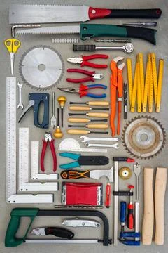 Flat lay of old hand tools on concrete background. Stock Photos