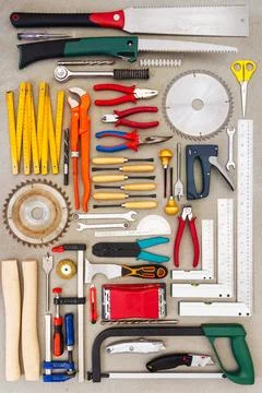 Flat lay of old hand tools on concrete background. Stock Photos