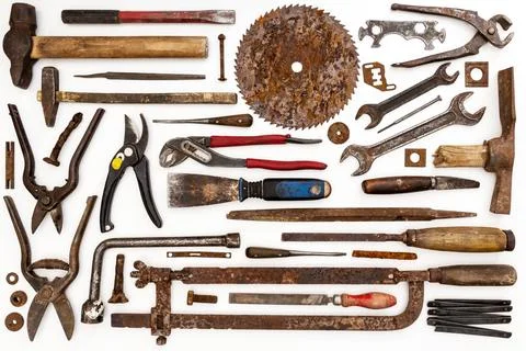 Flat lay of old hand tools on white background. Stock Photos