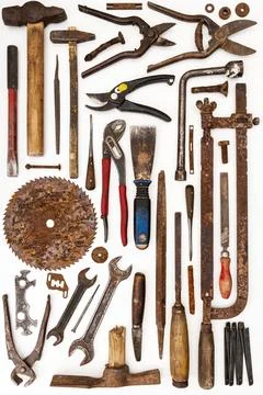 Flat lay of old hand tools on white background. Stock Photos