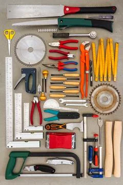Flat lay of old hand tools on concrete background. Stock Photos