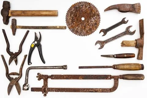 Flat lay of old hand tools on white background. Stock Photos