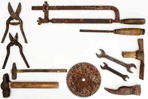 Flat lay of old hand tools on white background. Stock Photos