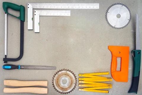 Flat lay of old hand tools on concrete background. Stock Photos