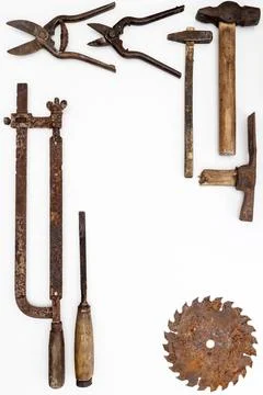 Flat lay of old hand tools on white background. Stock Photos