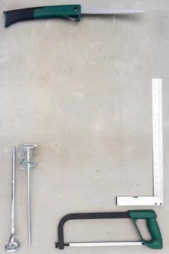 Flat lay of old hand tools on concrete background. Stock Photos