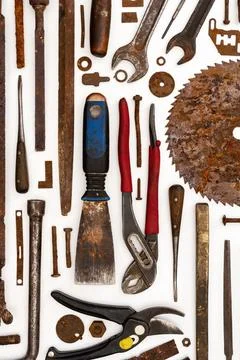 Flat lay of old hand tools on white background. Stock Photos
