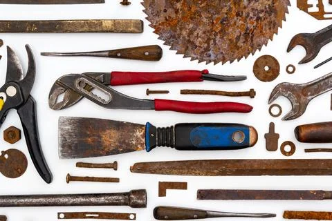 Flat lay of old hand tools on white background. Stock Photos