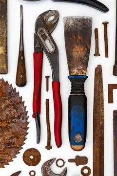 Flat lay of old hand tools on white background. Stock Photos