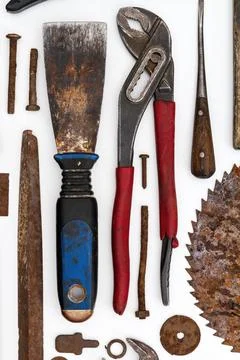 Flat lay of old hand tools on white background. Stock Photos