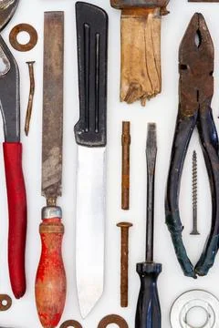 Flat lay of old hand tools on white background. Stock Photos