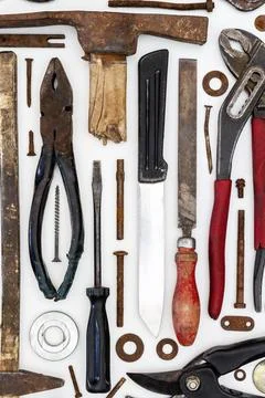 Flat lay of old hand tools on white background. Stock Photos