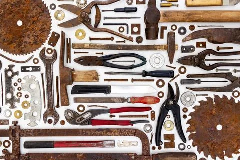 Flat lay of old hand tools on white background. Stock Photos