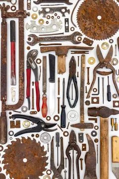Flat lay of old hand tools on white background. Stock Photos