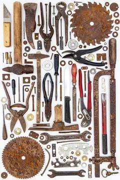 Flat lay of old hand tools on white background. Stock Photos