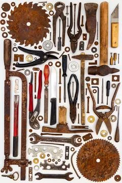 Flat lay of old hand tools on white background. Stock Photos