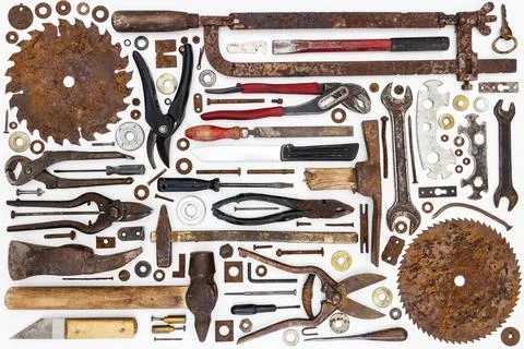 Flat lay of old hand tools on white background. Stock Photos