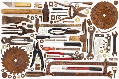 Flat lay of old hand tools on white background. Stock Photos