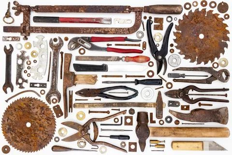 Flat lay of old hand tools on white background. Stock Photos