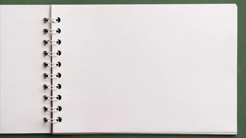 Flat lay of open blank empty spiral sketchbook notebook notepad with ring binder Stock Footage 232342678