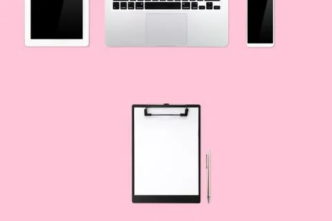 Flat lay or top view workspace office pink desk with laptop computer Stock Photos