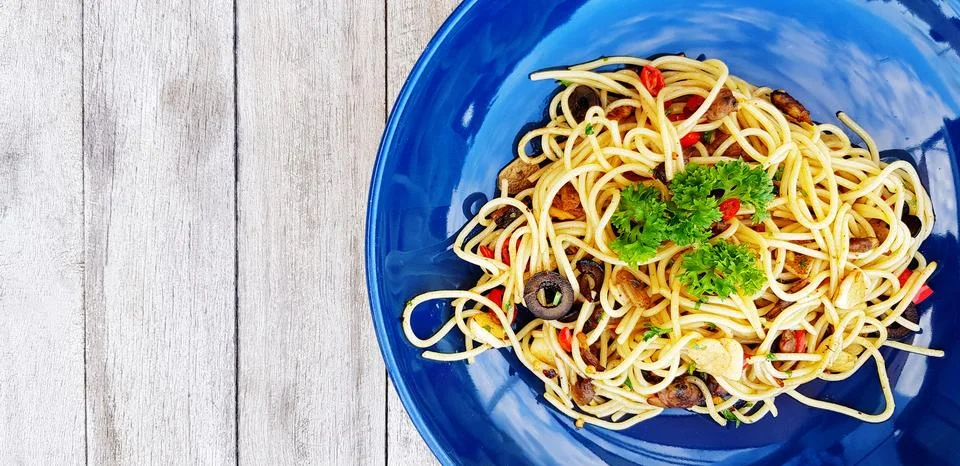 Flat lay or top view spaghetti with clams and mushroom sliced Stock Photos
