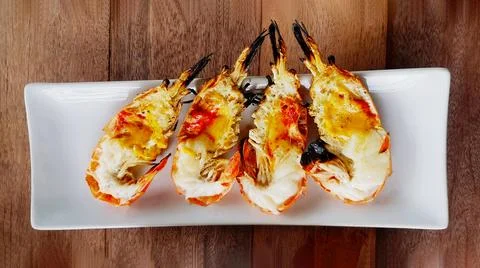 Flat lay or Top view of four Grilled giant river shrimp or prawn Stock Photos