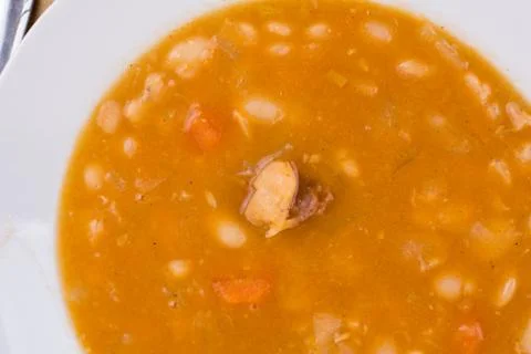 Flat lay overview cooked beans with sausage in the spoon Stock Photos