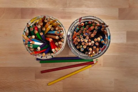 Flat lay overview of sharpened coloring pencils on wooden background Stock Photos
