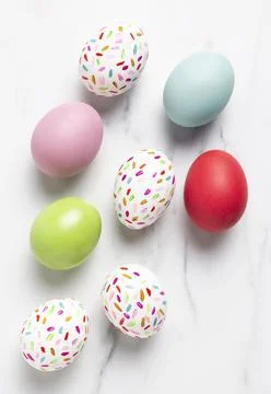 Flat lay painted easter eggs Stock Photos
