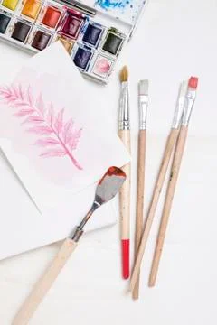 Flat lay of painting essentials with brushes Photo Stock Photos