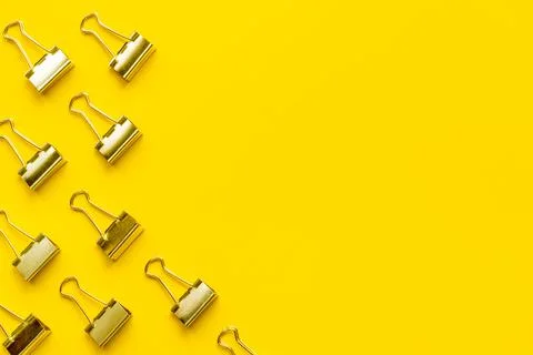 Flat lay of paper binder clips, office supplies pattern Stock Photos
