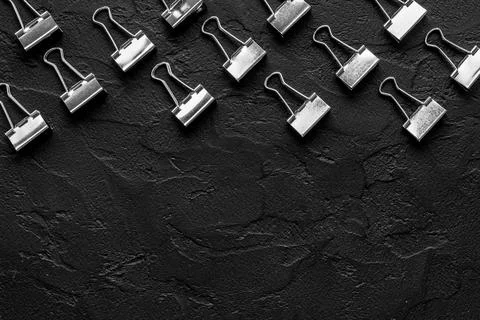 Flat lay of paper binder clips, office supplies pattern Stock Photos