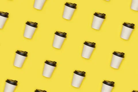 Flat lay paper white cup with back plastic cover pattern on yellow Stock Photos