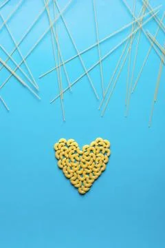 Flat lay of pasta in a shape of a heart 写真素材