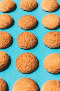 Flat lay of pattern of delicious cookies isolated on blue background Stock Photos