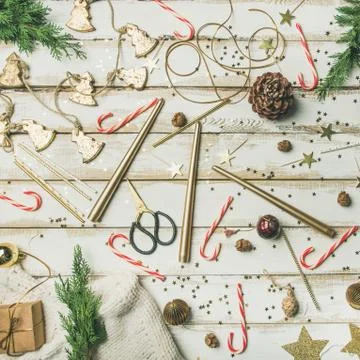 Flat-lay pattern of holiday decoration objects, toys, candles Stock Photos
