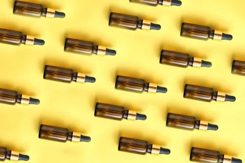 Flat lay pattern of natural cosmetics from small glass oil bottles Stock Photos