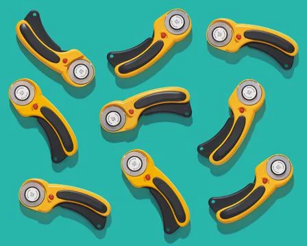 Flat lay pattern of rotary cutters on turquoise background. Top view Stock-Fotos