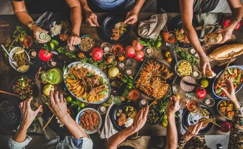 Flat-lay of peoples hands taking Turkish traditional foods Stock-Fotos