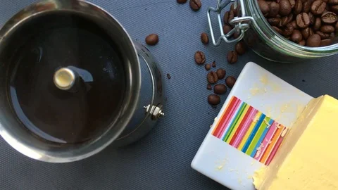 Flat lay person making bulletproof coffee in the morning - 8 s Stock Footage 127868668