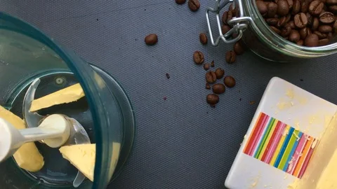 Flat lay person making bulletproof coffee at home- 25s Stock Footage 128014614