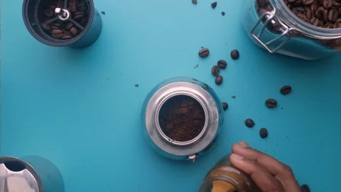 Flat lay of person making espresso coffee with moka pot- 8s Stock Footage 130158012