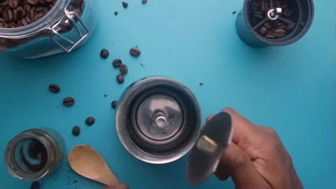 Flat lay person making espresso coffee with moka pot - 8 s Stock Footage 130158802