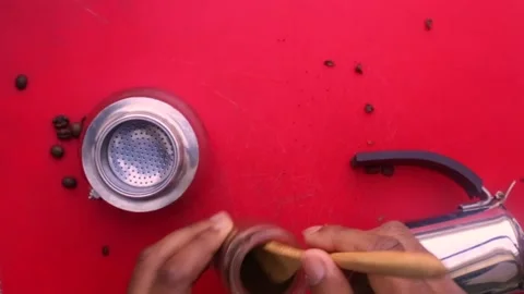 Flat lay person preparing espresso coffee with a moka pot - 8 s Stock Footage 130617865