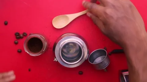 Flat lay person preparing espresso coffee with a moka pot - 8s Stock Footage 130617891