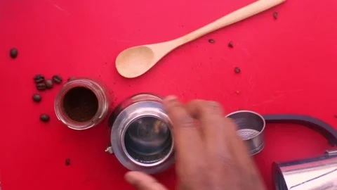 Flat lay person preparing espresso coffee with a moka pot -8s Stock Footage 130617916