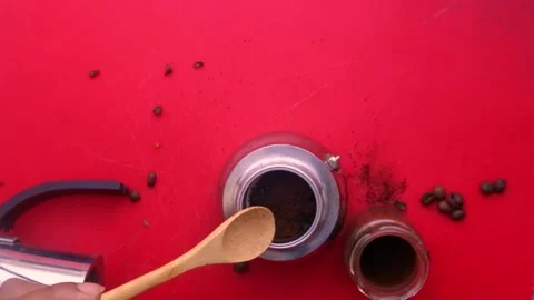 Flat lay person preparing espresso coffee with a moka pot at home - 8 sec Stock Footage 130617959